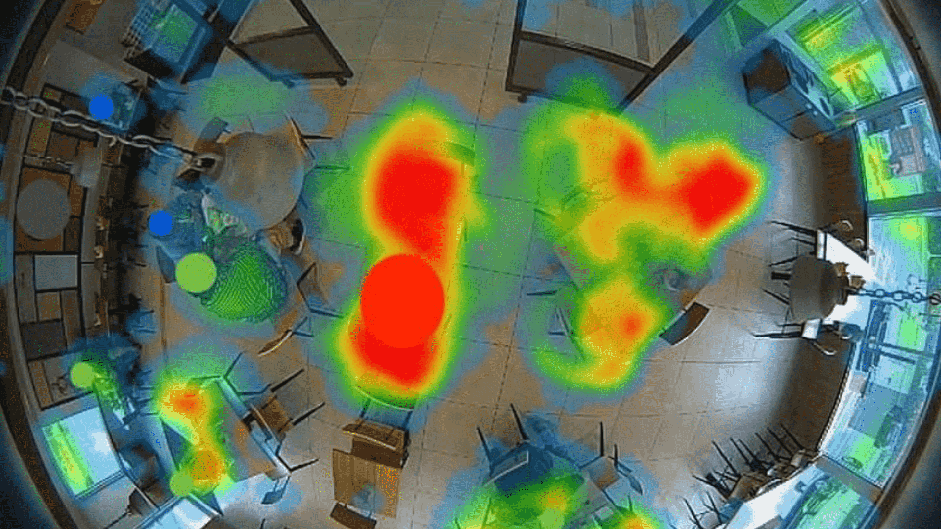 Aerial view of a restaurant with areas marked in orange, yellow, and green, a clear representation of heat mapping.