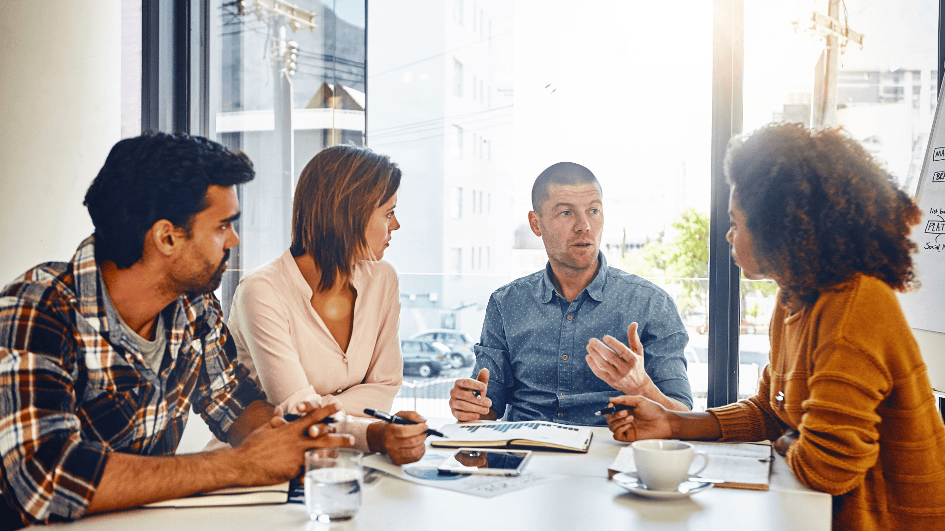 Group of people discussing business insights.