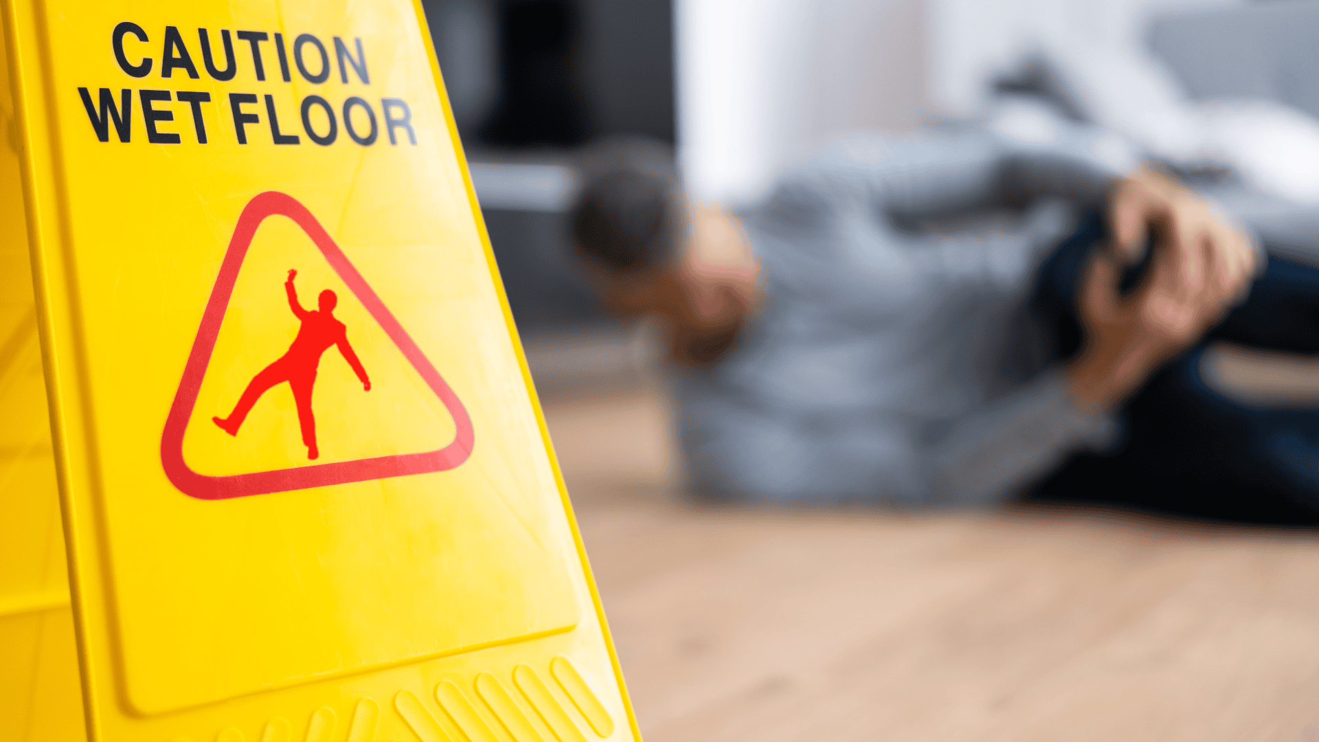 Image of a "Caution wet floor" signal and and a person lying on the floor with an injured knee as a related example of incident management.