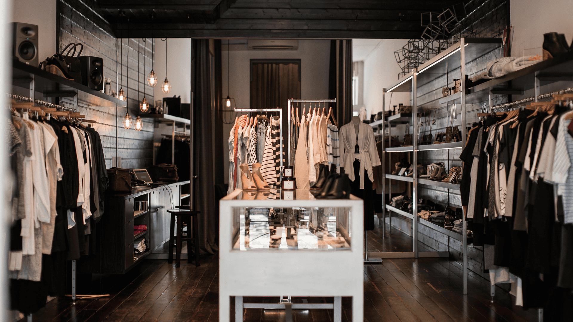 A stylish boutique with organized displays illustrates what is the purpose of physical security safeguards—to protect assets and deter theft.