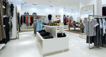 Picture of a clothing store, without customers, tidy and modern as a representation of a store in which retail loss prevention strategies can be applied.