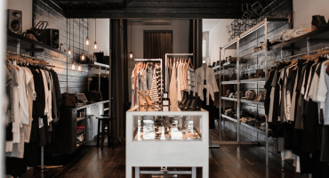 A stylish boutique with organized displays illustrates what is the purpose of physical security safeguards—to protect assets and deter theft.